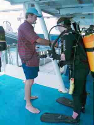 A tagging system is used to check everyone back on board Big Cat Reality.