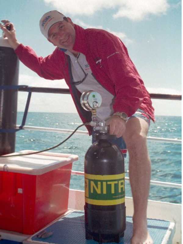Neil Harris decants pure oxygen on board Big Cat Reality.