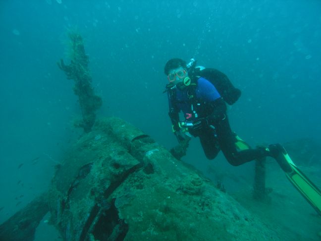 Andrew Whitehead near the inner port engine of the Kawanishi flying boat.  Image by Jim Thiselton.